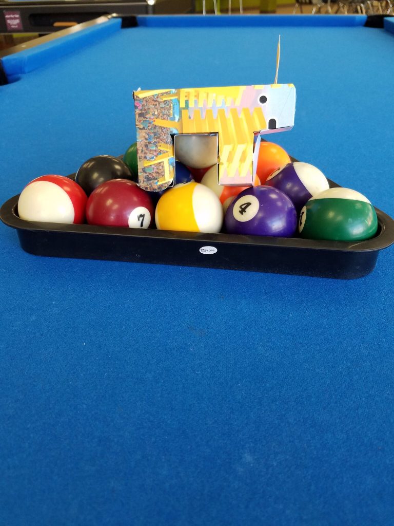 Coachella unicorn on pool table